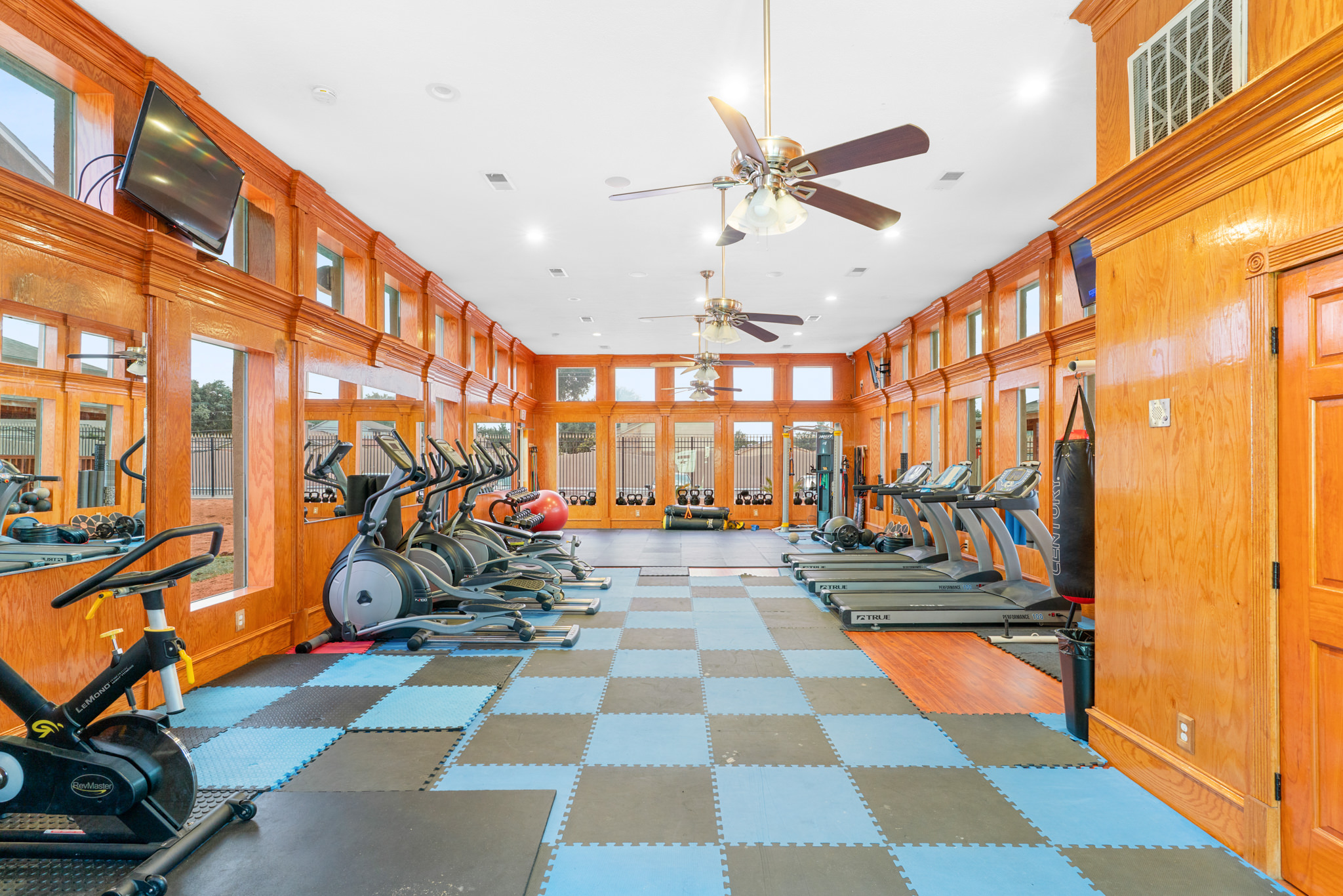 Falls of Bellaire apartments resident enjoy the amenities such as this spacious fitness center available at all times