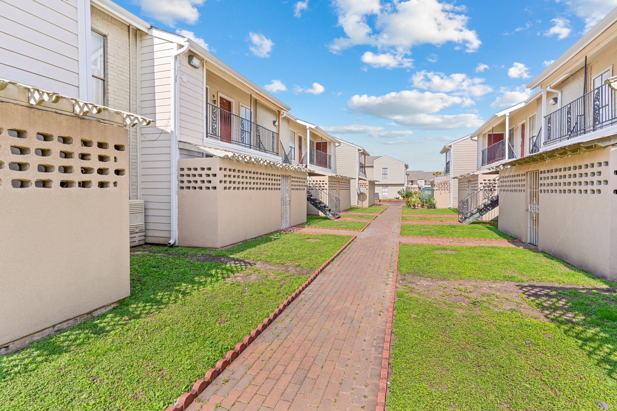 Enjoy private patios at Falls of Bellaire Apartments